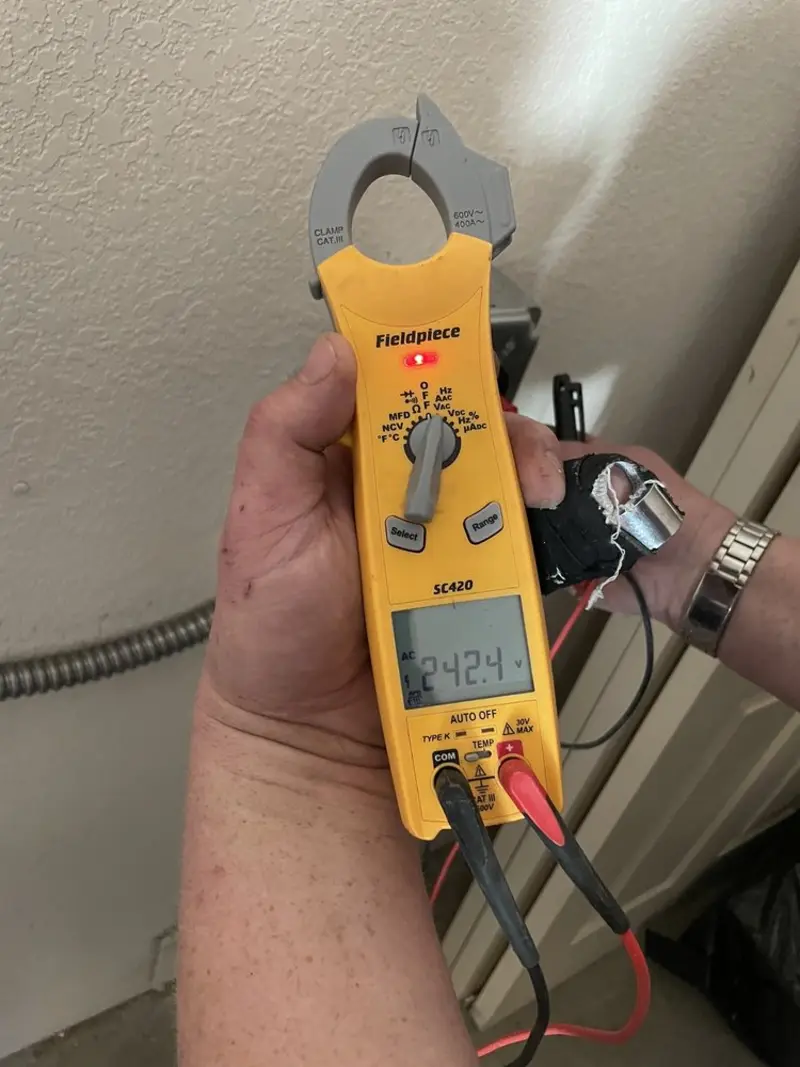 Voltage testing with clamp meter during Outlet Installation in Edwards